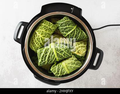 savoy cabbage rolls in instant pot pressure cooker Stock Photo