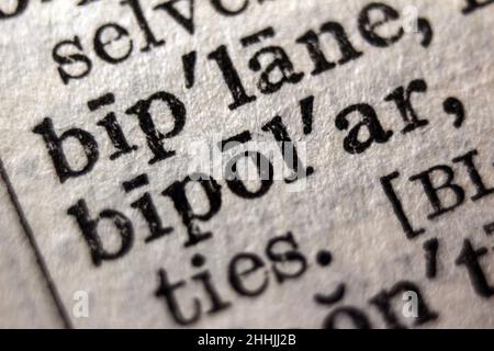 Definition of word bipolar on dictionary page, close-up Stock Photo