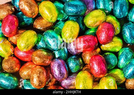 Over Head Shot Of Colourful Chocolate Easter Eggs On Table Stock Photo