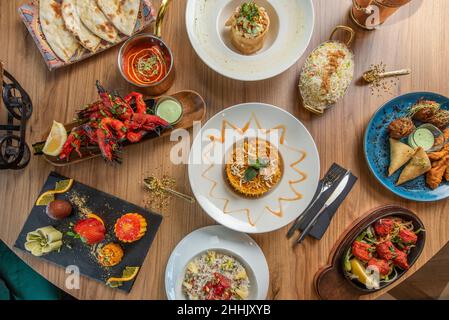 Set of Indian food dishes and appetizers with tikka masala, curry, nam, pilau rice, samosa Stock Photo