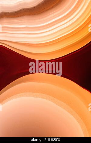 Macro of abstract background of agate gemstone with white and red spots and lines Stock Photo
