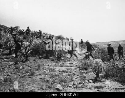 Abyssinian War October 1935Italian infantry with machine guns follow in the wake of the tanks during their advance from Adigrat to Makale Stock Photo