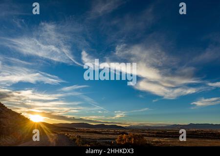 USA, Idaho, Bellevue, Sun setting behind hills Stock Photo