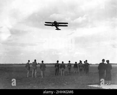 The De Havilland Dragon 'Trail of the Caribou'  at Heston aerodrome after flying across the Atlantic from Wasaga, Canada in 30hours 50 minutes. The plane was previously owned by Jim Mollison who attepted the same flight with Amy Johnson a year earlier. 9th August 1934. Stock Photo