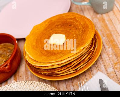 Thin pancakes with butter and mochanka of meat and mushrooms Stock Photo