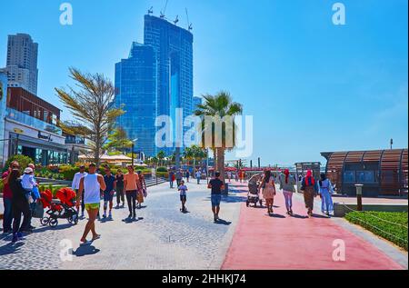 DUBAI, UAE - MARCH 7, 2020: The building of Address Jumeirah Resort and Spa complex is seen behind the JBR Marina Beach Walk, on March 7 in Dubai Stock Photo