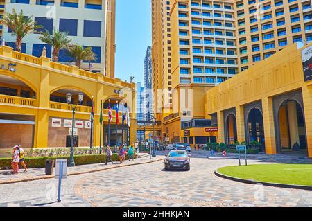 DUBAI, UAE - MARCH 7, 2020: The narrow curved street runs among the modern skyscrapers of Dubai Marina, on March 7 in Dubai Stock Photo