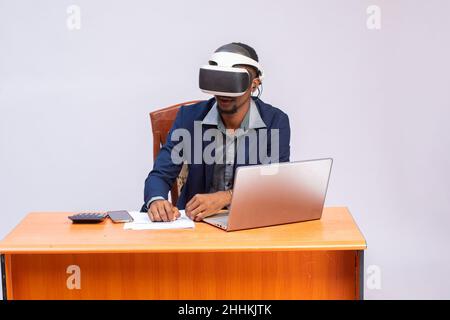 handsome african Employee using virtual reality glasses in office Stock Photo