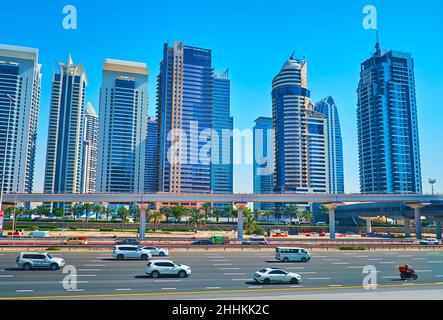 DUBAI, UAE - MARCH 7, 2020: The fast traffic in Sheikh Zaed Road, lined with skyscrapers of Jumeirah Lake Towers neighborhood, on March 7 in Dubai Stock Photo