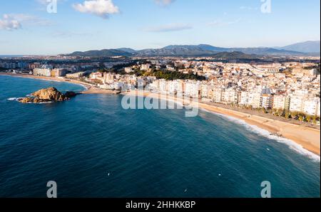 Aerial view of Blanes on Mediterranean coast overlooking Sa Palomera Rock and sandy beach Stock Photo