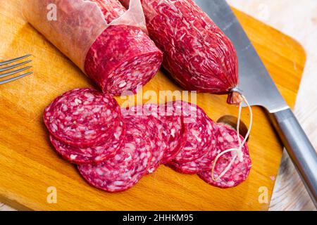 Slices of dry-cured sausage from Iberian pork seasoned with natural marinades Stock Photo