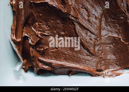 close up of creamy chocolate fudge with white background Stock Photo