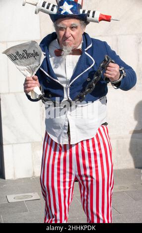Protestor wearing Uncle Sam custom participates in Defeat the Mandates march in Washington, DC, on January 23, 2022, protesting COVID-19 mandates. Stock Photo