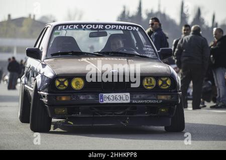 Nice classic BMW E30 tuned stance style with rusty bonnet Stock Photo