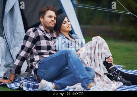Young nice couple having fun on camping Stock Photo