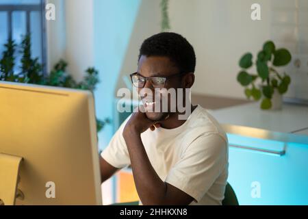 Happy successful programmer enjoy working from home on remote or freelance website or app project Stock Photo