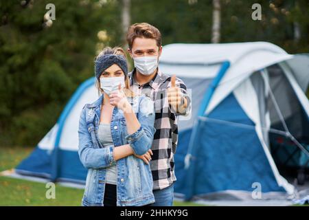 Young nice couple having fun on camping Stock Photo