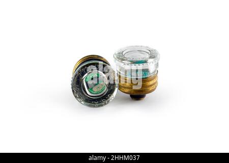 A pair of Edison base, 30A pyrex glass plug fuses isolated on a white background. cutout image for editorial and illustration use. Stock Photo