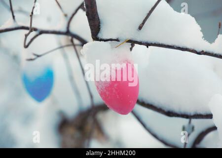 beautiful easter eggs on a tree branch outdoors Stock Photo