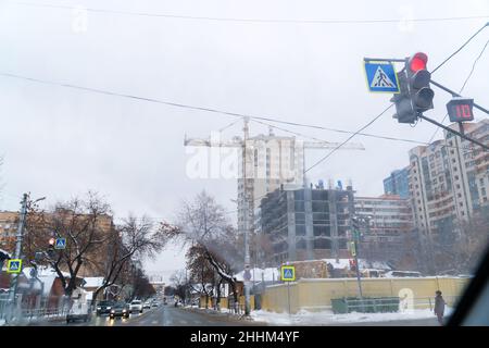 Samara, Russia - December 12, 2018: A construction site by the road behind a fence on a city street Stock Photo