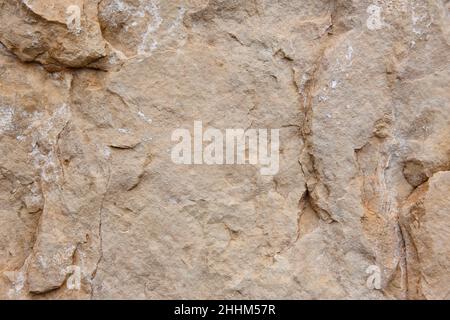 Natural stone background detail in warm tone. Texture Stock Photo