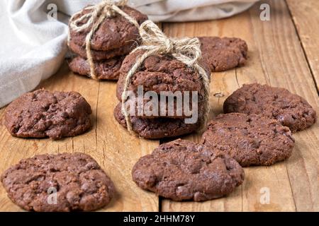 Choc-chip cookies stacked on each other tied with brown string Stock Photo