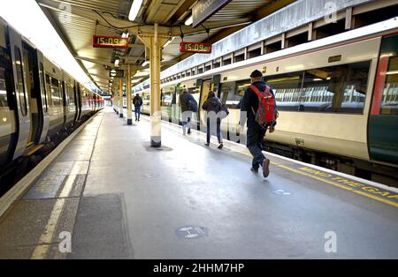 London, England, UK. Victoria Station - Passengers on the platform Stock Photo