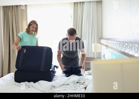A couple in the room are packing things Stock Photo