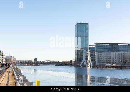 Berlin, Germany - December 26, 2021: view of the other shore from the Spree river embankment between the Oberbaunum bridge and Elsen Bridge Stock Photo