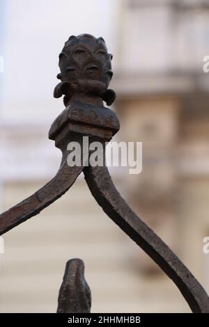 Wrought iron fence. Decorative wrought iron fence. Metal fashion fence. Stock Photo