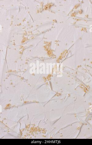 Textured handmade paper with pieces of adhesive tape and beads. Vertical background handmade for design Stock Photo