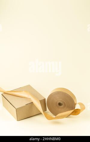 Biodegradable eco friendly paper sticky tape with cardboard box Stock Photo