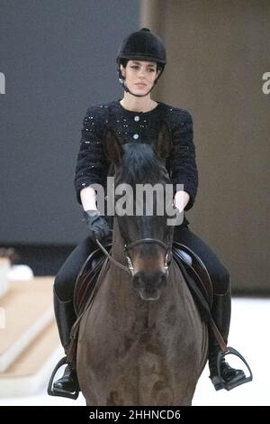 Charlotte Casiraghi rides a horse on the runway during the Dior Homme ...