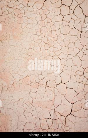 cracked plastered wall background, distressed painted surface texture, photography backdrop, empty full frame closeup Stock Photo