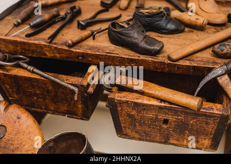 Closeup shot of different tools of a cobbler workplace Stock Photo