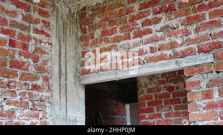Freshly made brick wall with the mortar of cement, sand and water, selective focus Stock Photo