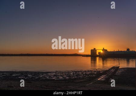 Sunset over Southampton Grain Terminal in the Eastern Docks, Southampton Water, Southampton, Hampshire, England, UK Stock Photo