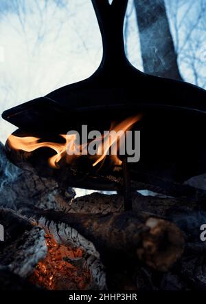 Cooking outdoors over fire Stock Photo