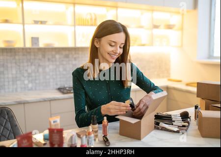 Long Haired Cute Beaitician Conducting An Online Beauty Workshop Stock Long Haired Cute Beaitician Conducting An Online Beauty Workshop Stock