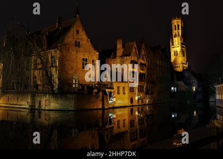 Bruges canals in winter at night with view of the Belfry (Belgium) Stock Photo