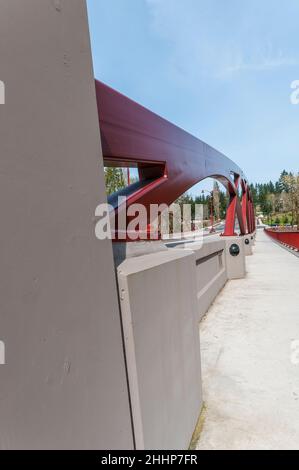 Closeup of the artistic arches showing how they are secured to the concrete barriers on the May Creek Bridge in Newcastle, Washington. Stock Photo