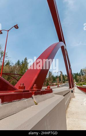 Closeup of the artistic arches showing how they are secured to the concrete barriers on the May Creek Bridge in Newcastle, Washington. Stock Photo