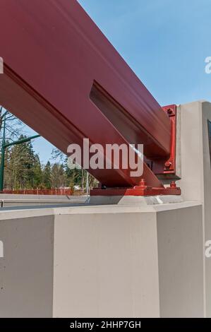 Closeup of the artistic arches showing how they are secured to the concrete barriers on the May Creek Bridge in Newcastle, Washington. Stock Photo