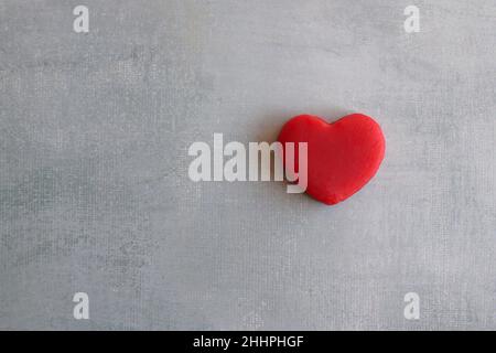 Top view image of red heart on concrete floor with copy space Stock Photo