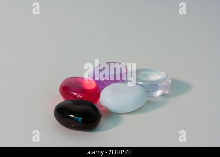 close-up of bitter glass cubes on a white background. One black glass stone.Product photo Stock Photo