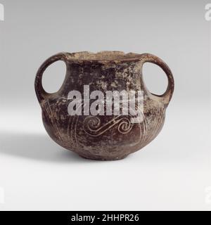 Terracotta two-handled jar early 7th–mid 7th century BC Italic, Villanovan Reddish-brown, two-handled, with incised curvilinear decoration.. Terracotta two-handled jar  246595 Stock Photo