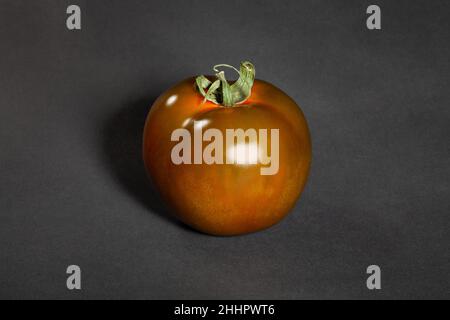 kumato tomato on black background Stock Photo