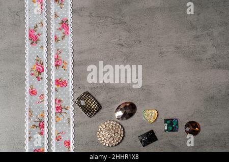 Ribbon on a grey background.Copy space.Flower ribbon.Handmade Stock Photo