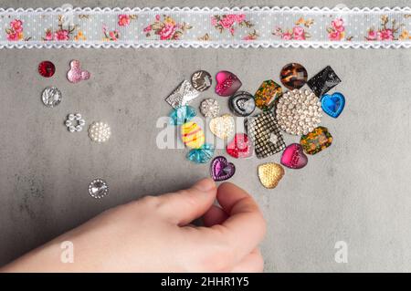 multi-colored sewn stones on a grey background.Copy Space Stock Photo