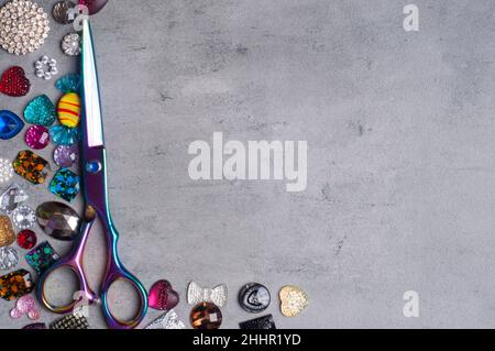 multi-colored decoration for sewing on a grey background.Copy Space Stock Photo